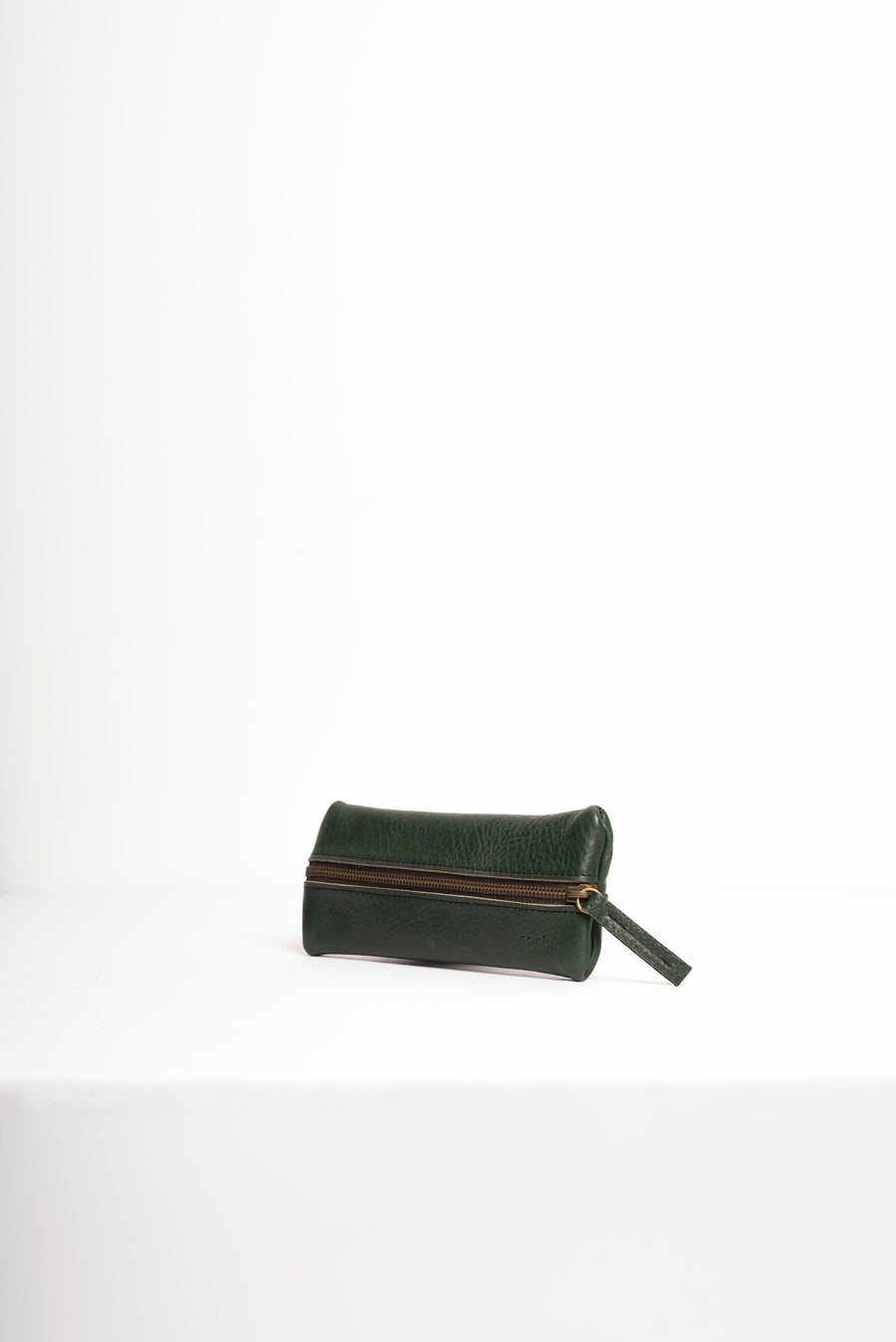 Natural-grained unlined leather pencil case.